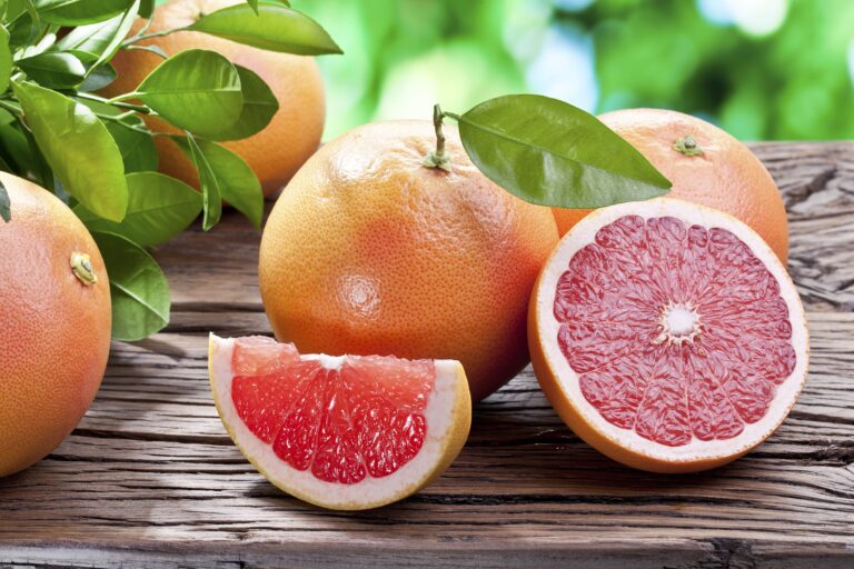 a group of grapefruit resting on a table